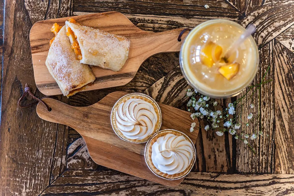 A board of pastries and coffee.
